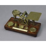 A vintage Mansfield of Dublin brass letter scale mounted on walnut plinth base, & with seven brass