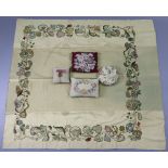 A vintage fawn cotton tablecloth with embroidered crewel-work floral border, 72” x 65”; together wit