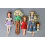 Four various celluloid dolls; & various items of doll’s clothing.