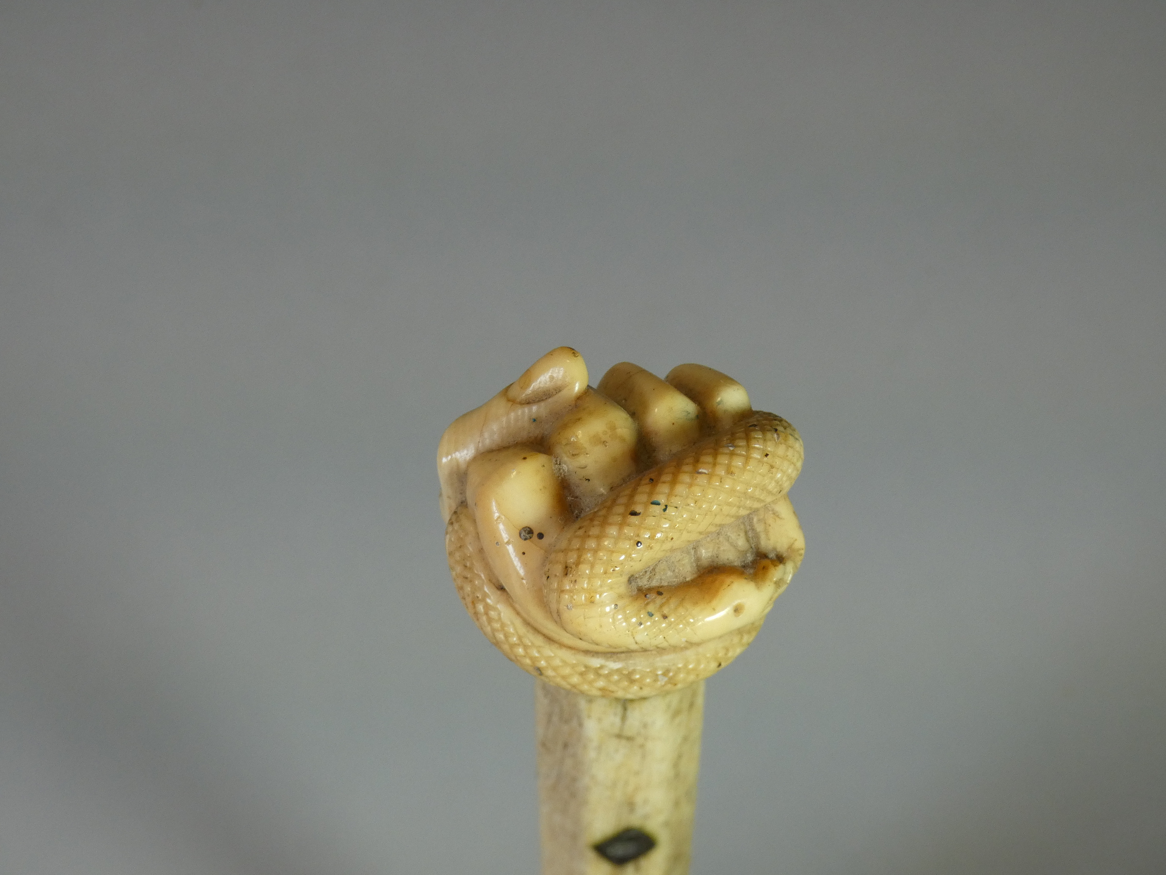 A 19th century whale jaw-bone & ivory-handled walking stick carved with a fist clutching a - Image 5 of 7