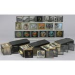 A quantity of assorted vintage glass magic lantern slides.