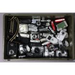 A collection of approximately one hundred various digital cameras.