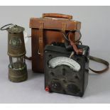 An Eccles of Manchester brass & steel "Type A1" miners’ lamp, 10" high; & an Avo meter with