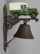 A modern painted cast-iron house bell with Land Rover surmount, 13” high.