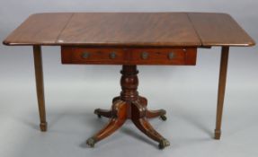 A regency mahogany sofa table, fitted two frieze drawers to one end with brass foliate ring handles,