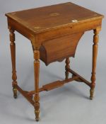 A 19th century inlaid-mahogany work table with fitted interior enclosed by hinged lift-lid, & on