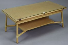 A Lloyd Loom gold painted wicker & wooden two-tier coffee table with rectangular glass top, on round