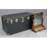 A blue fibre-covered travelling trunk with a hinged lift-lid, 40” wide x 19¾” high x 19¾” deep; &
