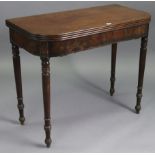 A 19th century mahogany tea table with moulded edge & rounded corners to the rectangular fold-over