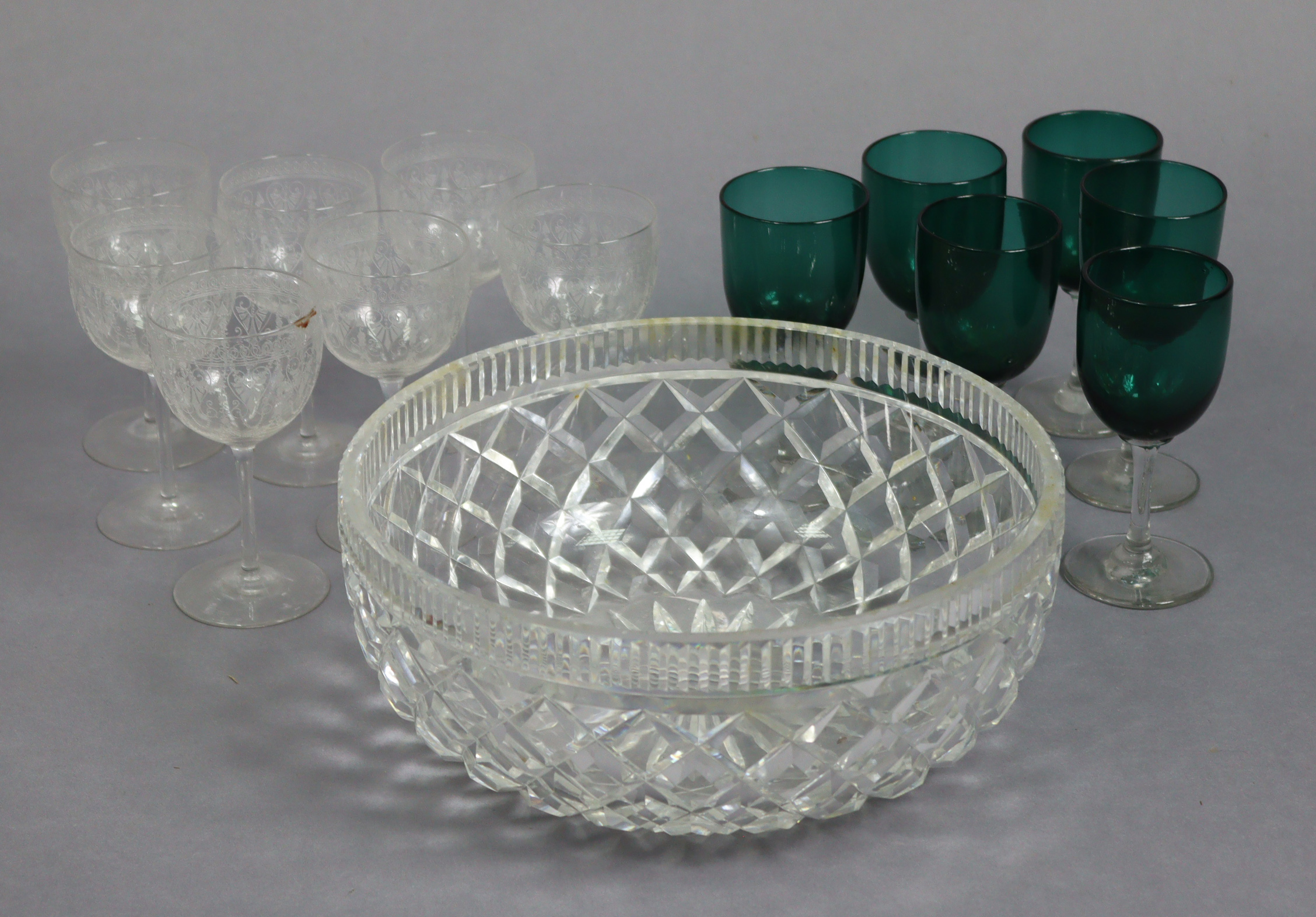 A Waterford cut-glass fruit bowl, 9¾” diameter; a set of six Victorian glass wines with emerald