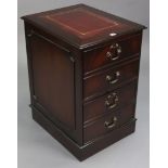 A mahogany dwarf three-drawer filing cabinet inset gilt-tooled crimson leather, & on plinth base,