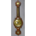 A late 19th/early 20th century aneroid wall barometer with 7¾” diameter brass dial, & in a