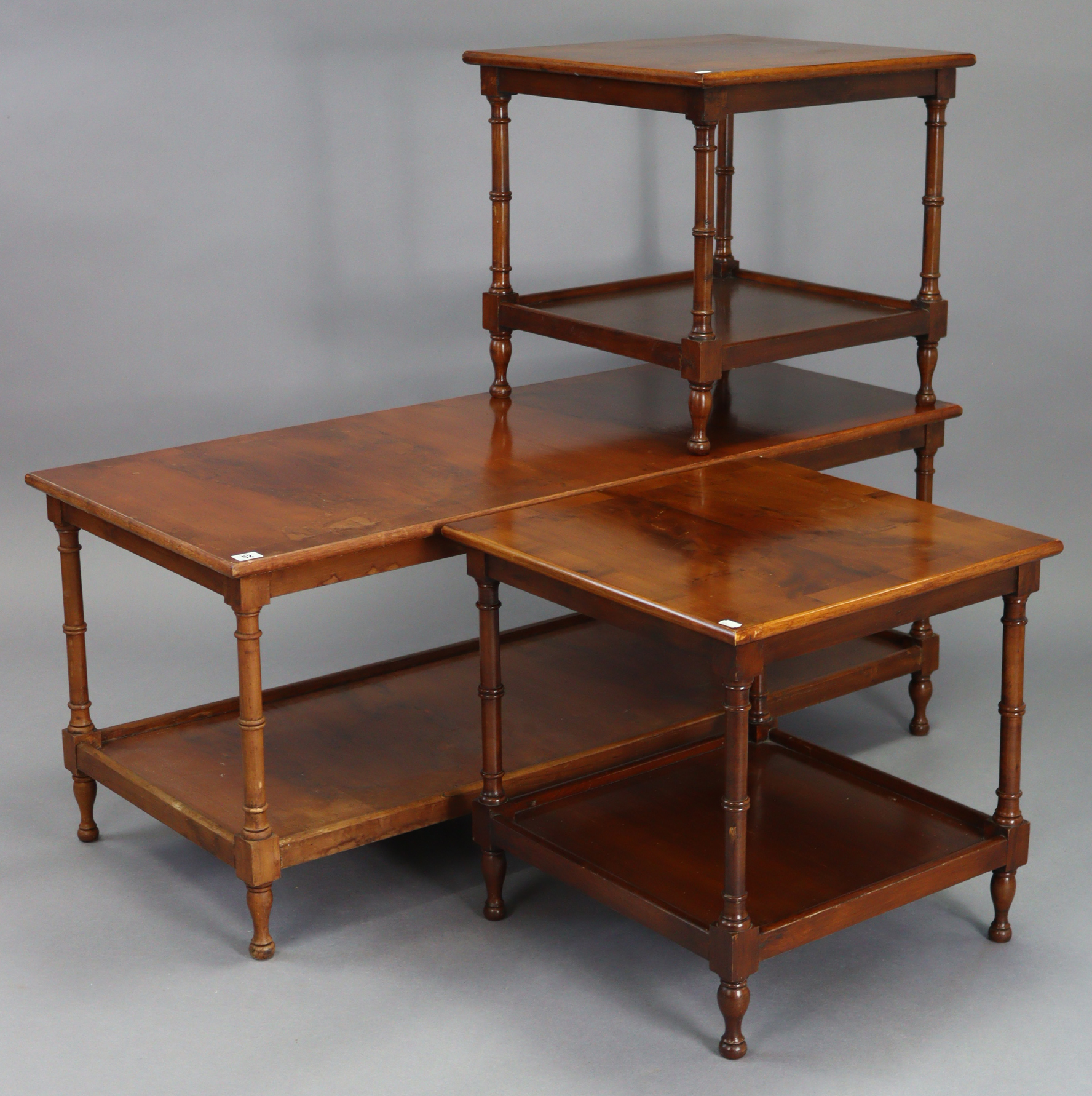 A reproduction yew-wood low rectangular two-tier coffee table on turned supports, 48½” wide x 20”