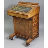 A Victorian inlaid-walnut davenport, inset gilt tooled leather to the hinged sloping front, fitted
