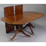 A GEORGE III-STYLE INLAID MAHOGANY TWIN-PEDESTAL EXTENDING DINING TABLE with moulded edge &