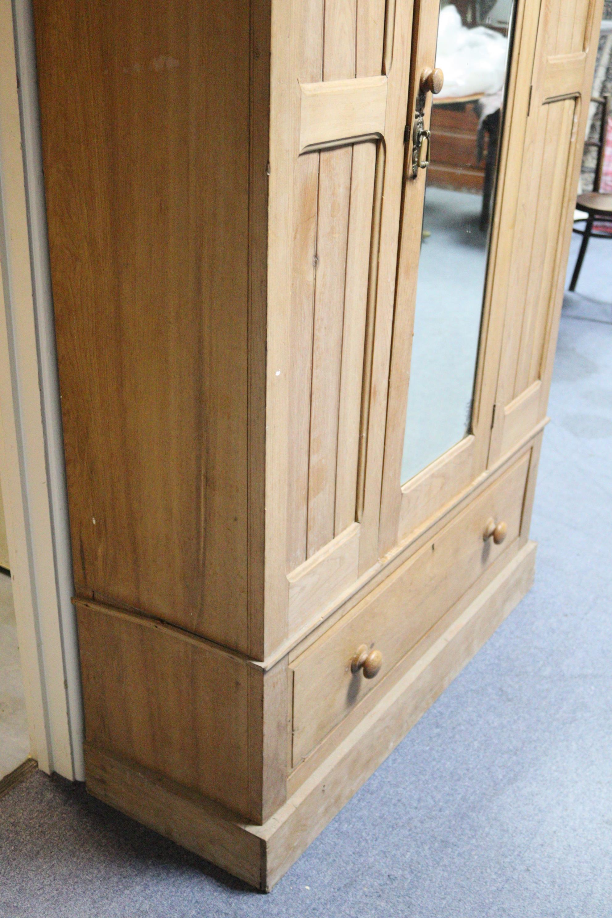 A late Victorian bleached walnut wardrobe with moulded cornice, enclosed by a rectangular bevelled - Image 9 of 9