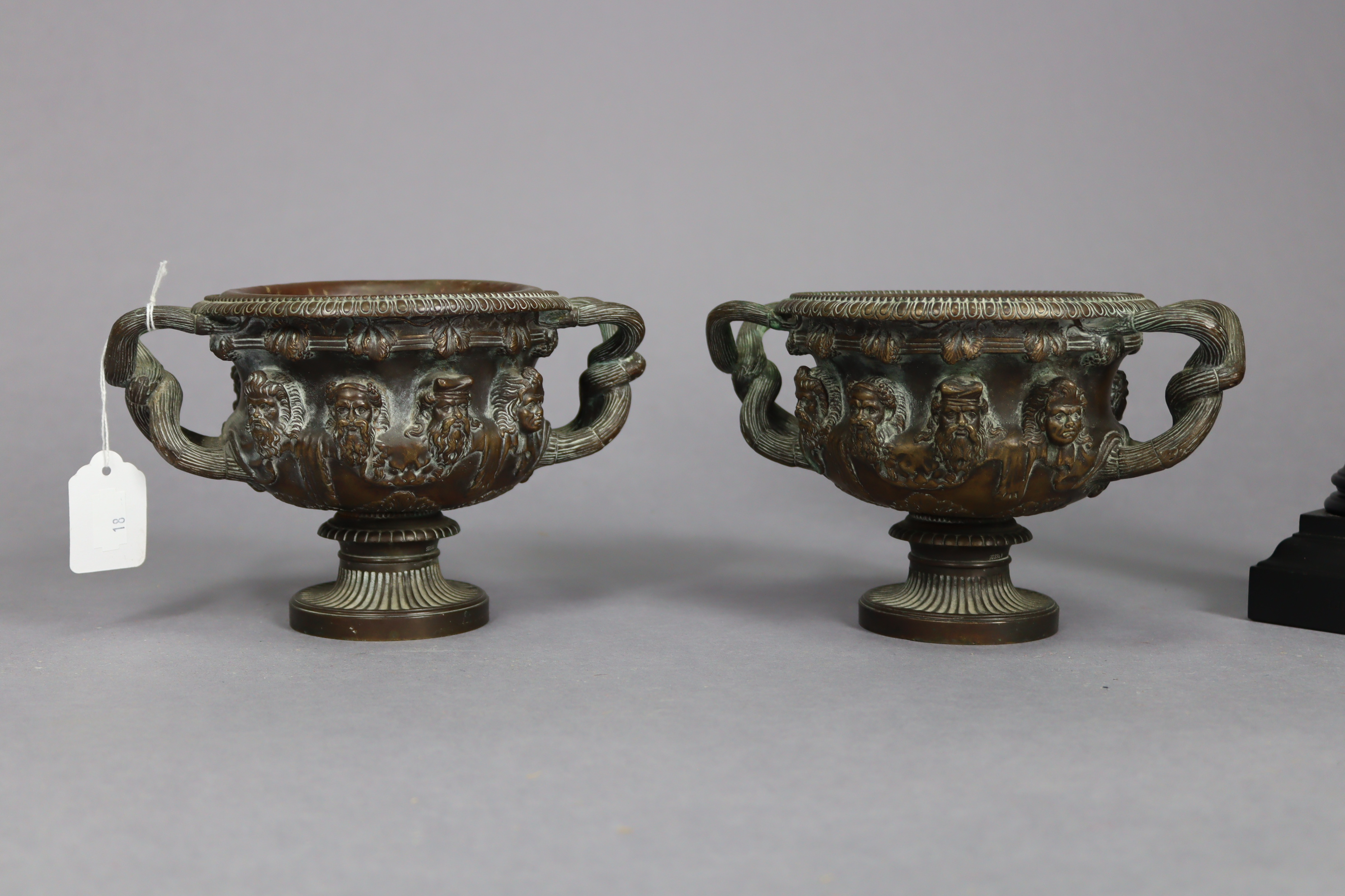 A pair of bronzed circular two-handled vases each with raised mask design & on a round pedestal - Image 4 of 6