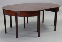 A Georgian mahogany D-end dining table with plain top & frieze, on fluted square legs, with