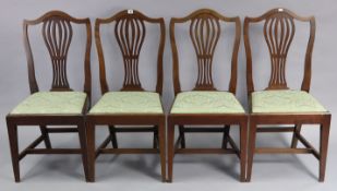 A set of four Georgian-style mahogany dining chairs, with pierced & shaped backs, padded drop-in