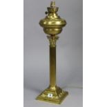 A Corinthian-style tall brass oil table lamp converted to electricity (lacking shade), 25½” high.