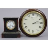 A late 19th/early 20th century mantel clock with black Roman numerals to the white enamel dial, & in