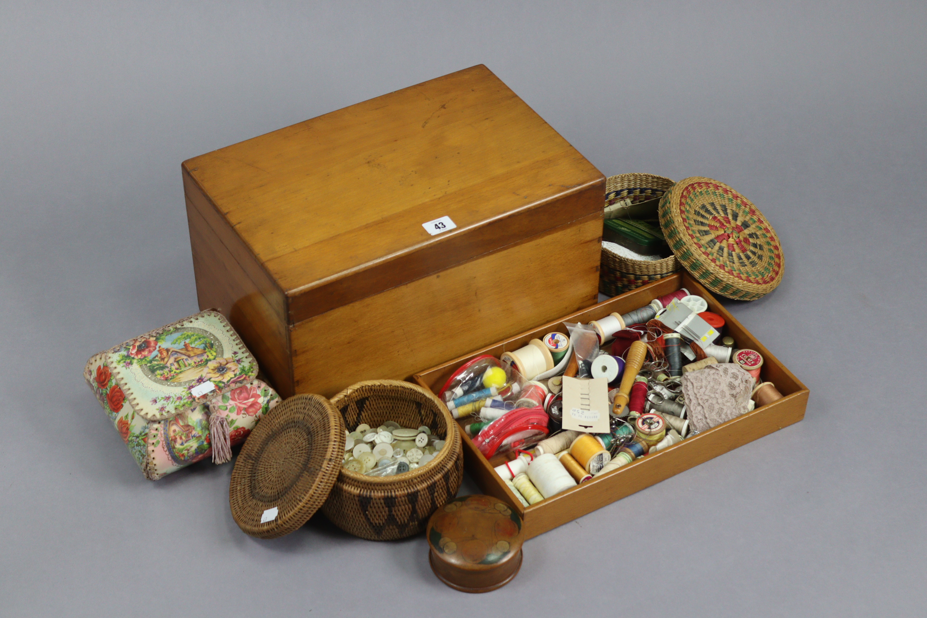 A walnut needlework box with a hinged lift-lid, 15¼” wide, with contents; & a collection of