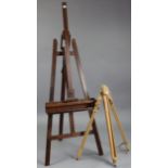 A Winsor & Newton beech portable easel; & a wooden fold-away studio easel, 68” high.