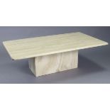 A Travertine cream marble low coffee table with rounded corners to the rectangular top, & on a