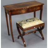 A reproduction mahogany bow-front side table, fitted two frieze drawers & on sabre legs, 33½” wide x