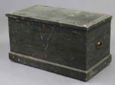 An early/mid-20th century black painted deal travelling trunk with a hinged lift-lid, & with