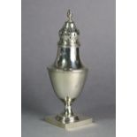 A late Victorian silver vase-shaped sugar caster with flame finial, reeded rims, & on square