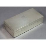 A late Victorian silver rectangular cigarette box with engraved crest & monogram to the hinged