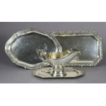 A German .800 standard oval sauce boat on integral oblong stand with canted corners & cast border of