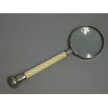 A Victorian silver-mounted magnifying glass with 2¼” lens, engraved & embossed terminal to the
