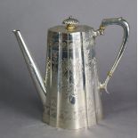 A Victorian silver coffee pot of oval tapered form & serpentine outline, with engraved foliate