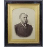 A late 19th century photographic portrait of a gentleman, displayed inornate gilt gesso frame &