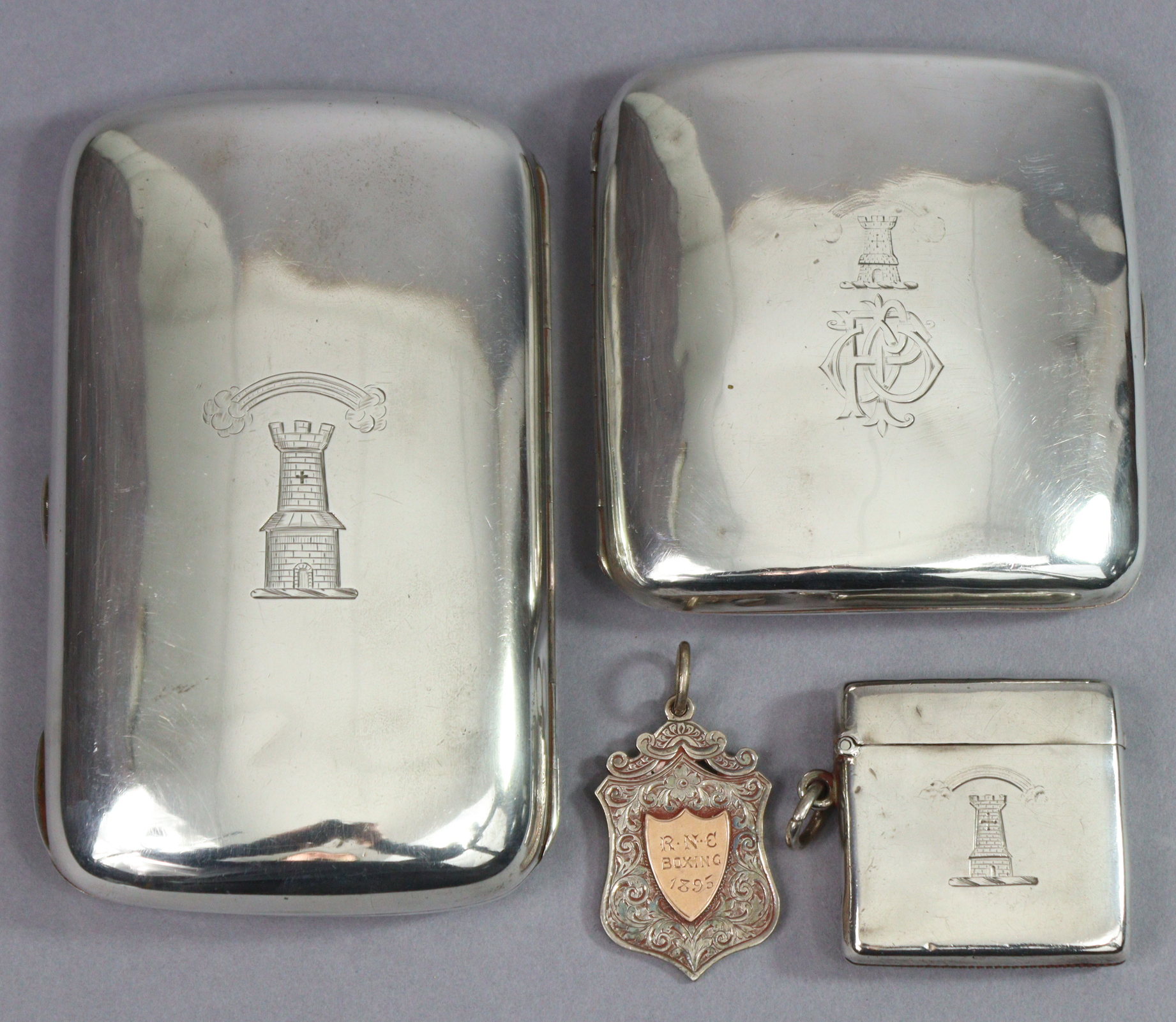 A late Victorian silver pocket cigarette case of curved rectangular shape, with engraved family