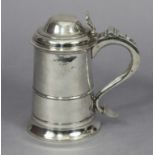 A George III provincial silver lidded tankard of tapered cylindrical form, with narrow moulded