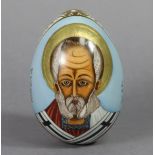 A RUSSIAN IMPERIAL PORCELAIN EASTER EGG, the pale blue-ground front with portrait of a Saint, the