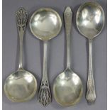 A pair of George V silver serving spoons with pierced floral terminals & round bowls, 8” long,