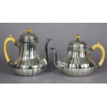 A mid-Victorian silver coffee pot & matching teapot, each of fluted baluster form, with ivory scroll