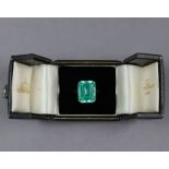 A simulated aquamarine ring, the large rectangular stone of blue-green colour, measuring approx.