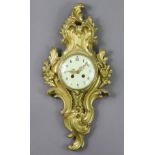 A late 19th century French cartel clock in the Louis XVI style, with 4½” cream dial, & in gilt brass