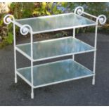 A white painted wrought iron three-tier garden table, inset plate-glass surfaces, on spiral-