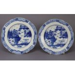 A pair of 18th century Caughley blue & white porcelain plates painted with Chinese river landscapes,