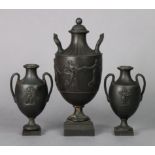 A late 18th century Wedgwood black basaltes two-handled classical vase decorated in relief with “
