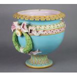 A Minton Majolica jardiniere of rounded form of turquoise ground, the upper rim & shoulder with