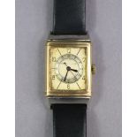 A Jaeger LeCoultre reversible-dial gent’s wristwatch in 9ct. Gold case, the rectangular silvered