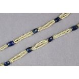 An early 20th century sapphire & seed-pearl necklace, the “pebble” sapphires set at intervals