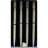 A set of four Sterling propelling Bridge pencils, each with block terminal engraved with one of